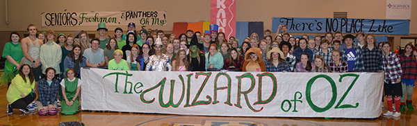 Students with a sign that says The Wizard of OZ